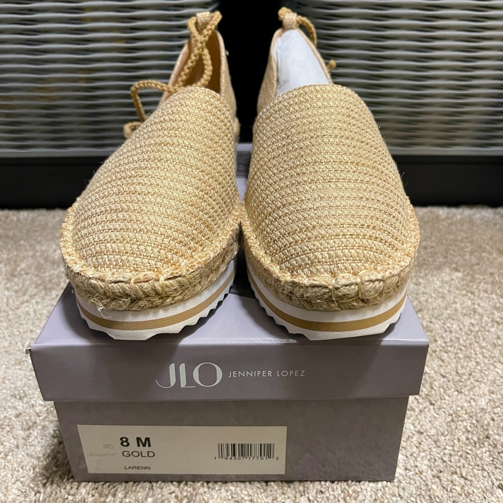 Soft sole, beige and gold flats with ankle straps. Brand new, in box.